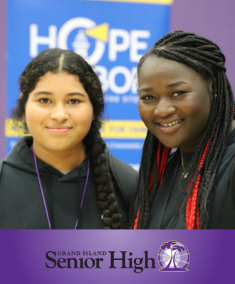  Two girls smiling at GISH student volunteer fair.